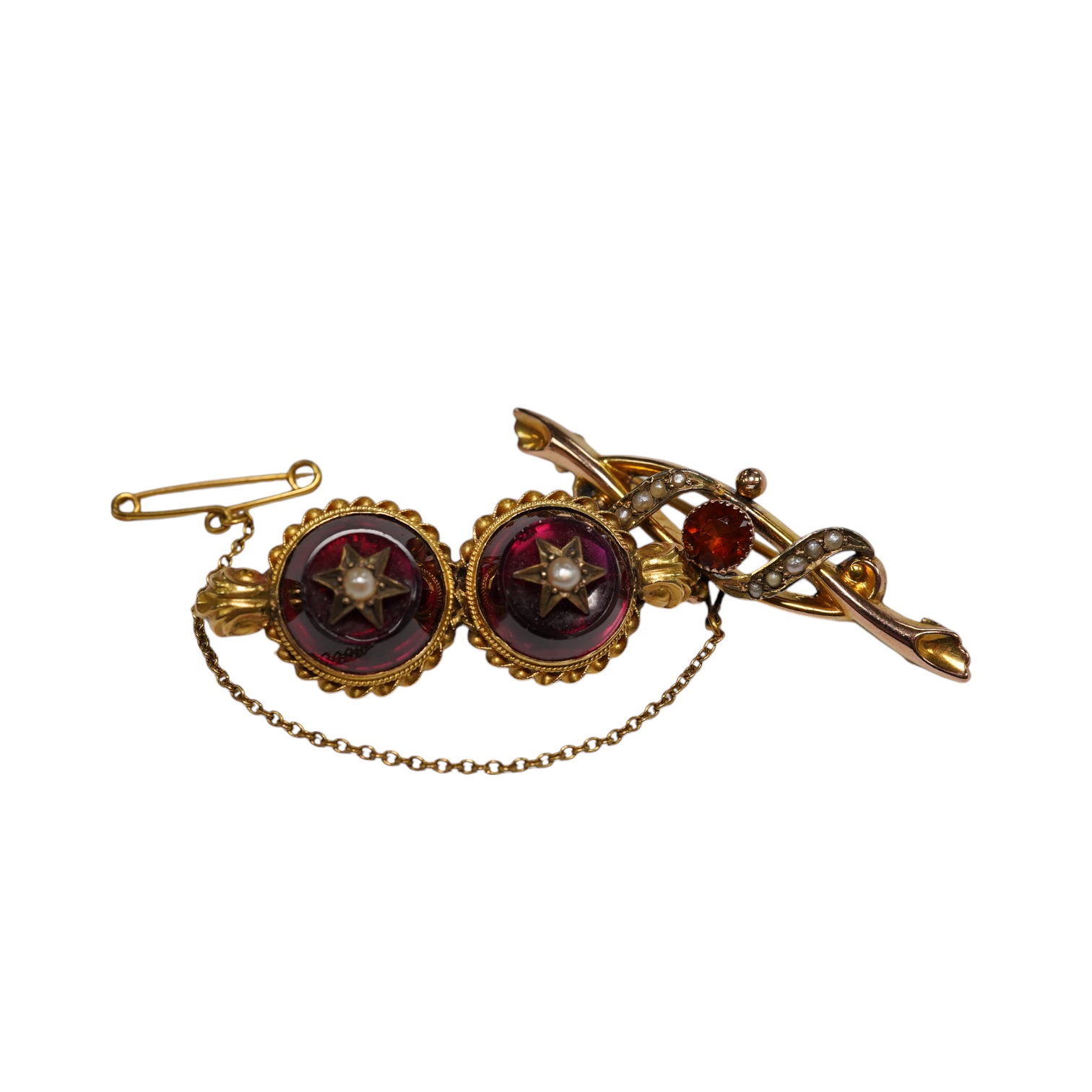 An Edwardian 9ct gold, hessonite garnet and seed pearl cluster set bar brooch, 42mm and a Victorian yellow metal, garnet and seed pearl set bar brooch, gross weight 7.3 grams, Condition - fair to good